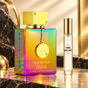 Armaf Club de Nuit Untold 105ml bottle beside a Wear This Next 10ml decant